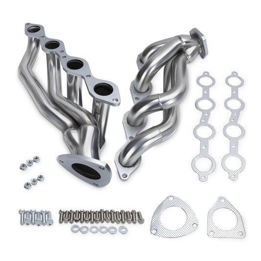 Set of stainless steel exhaust pipes with gaskets and hardware on a white background