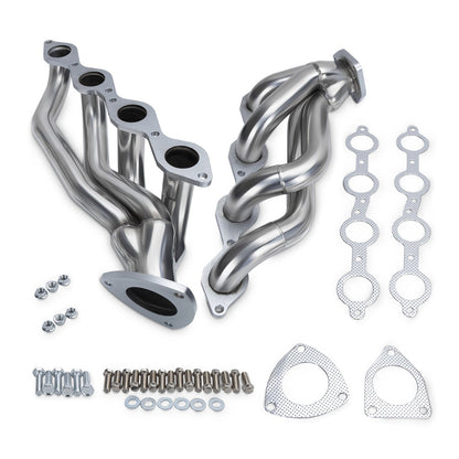 Set of stainless steel exhaust pipes with gaskets and hardware on a white background