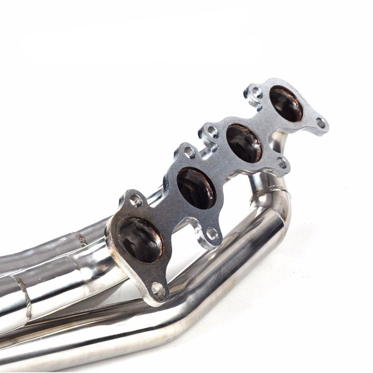 Close - up of polished long tube exhaust header flange with four ports