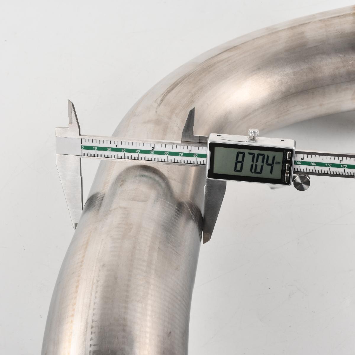 Digital caliper measuring the downpipe’s diameter (87.04mm outer, 85.89mm inner, 15.2mm flange thickness) for precise fitment on 2017-2023 Chevy Silverado/GMC Sierra L5P 6.6L.