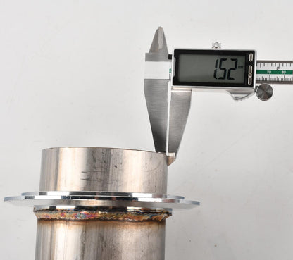 Digital caliper measuring the downpipe’s diameter (87.04mm outer, 85.89mm inner, 15.2mm flange thickness) for precise fitment on 2017-2023 Chevy Silverado/GMC Sierra L5P 6.6L.