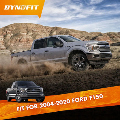 Ford F-150 truck driving on a dirt road with mountains in the background, featuring Dynofit branding.